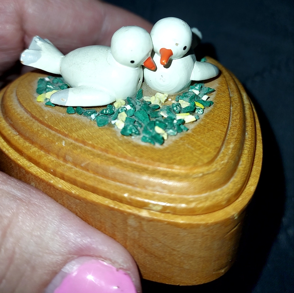 White Little Birds On Top Og A Small Trinket Box.